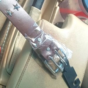 Brown belt with metal rings and stars. Brand new every size.